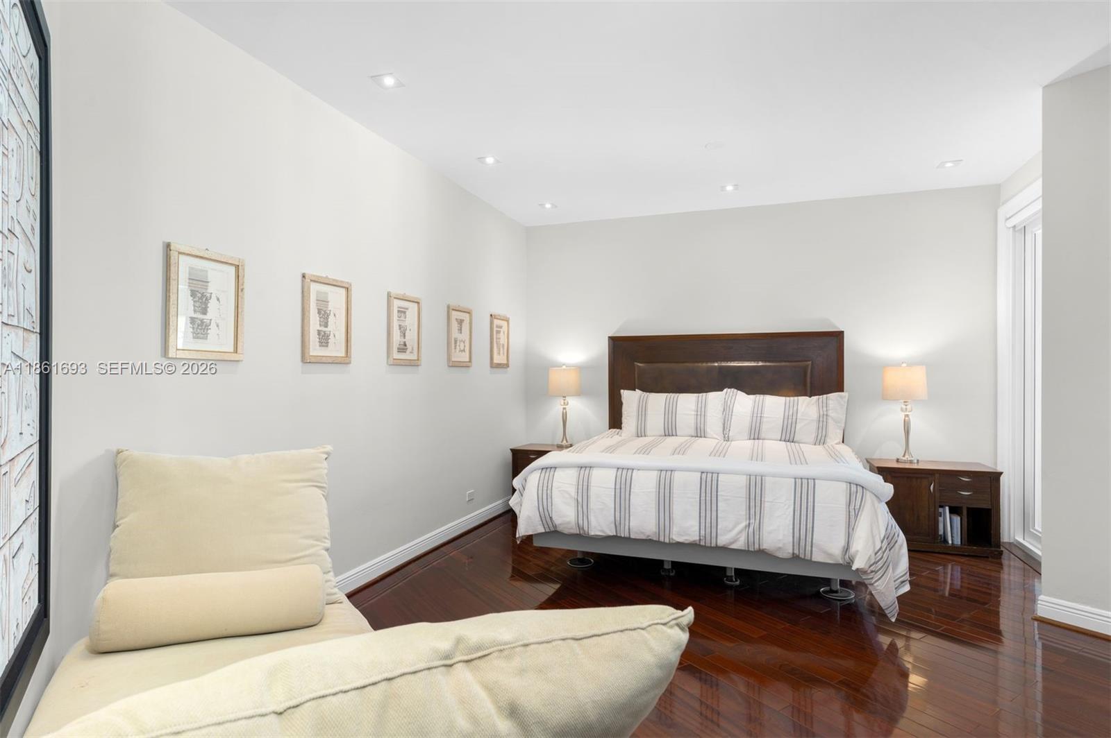 12801 Old Cutler Road Pinecrest, FL 33156 - Photo 23 of 56 a room with a bed and a couch