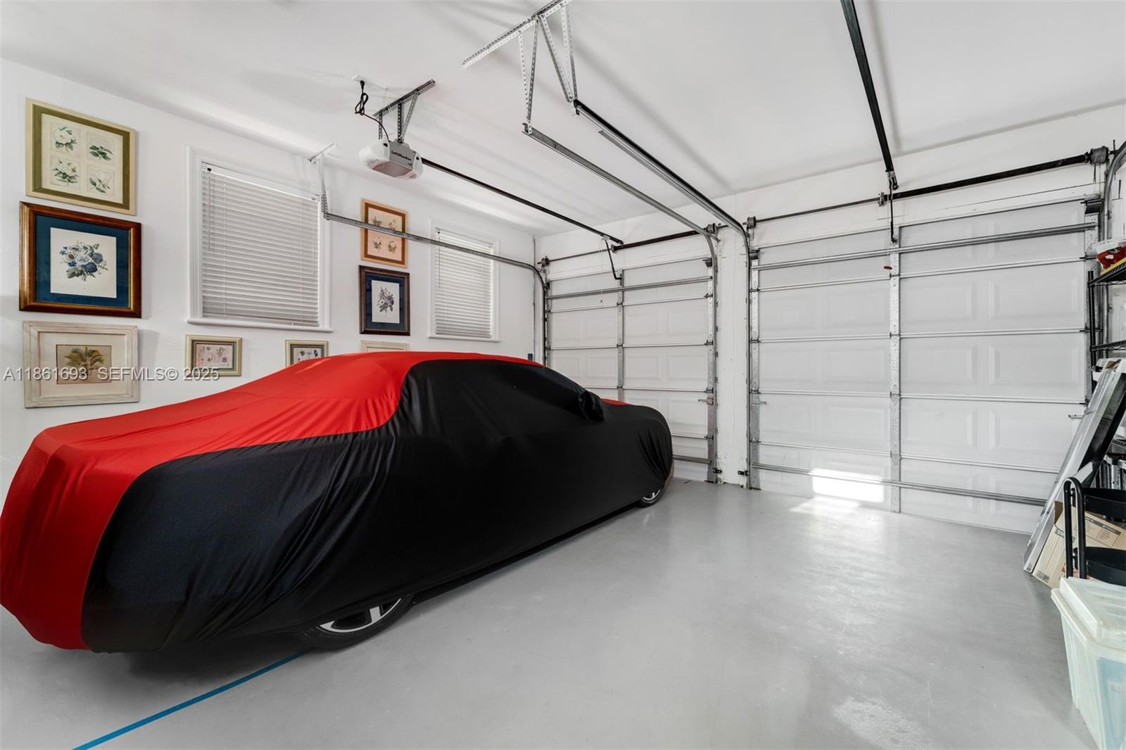 12801 Old Cutler Road Pinecrest, FL 33156 - Photo 35 of 56 a bedroom with a bed and a walk in closet