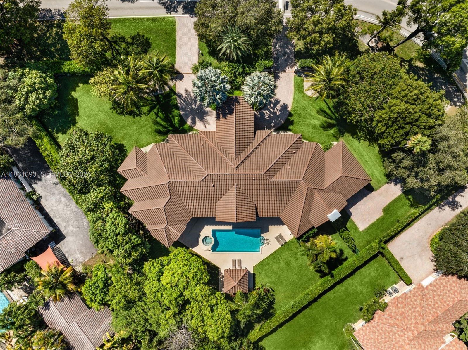 12801 Old Cutler Road Pinecrest, FL 33156 - Photo 48 of 56 an aerial view of a house with garden space and street view