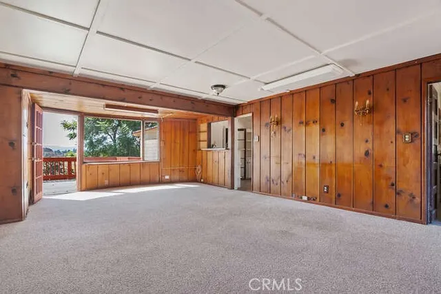 a view of a room with a large window