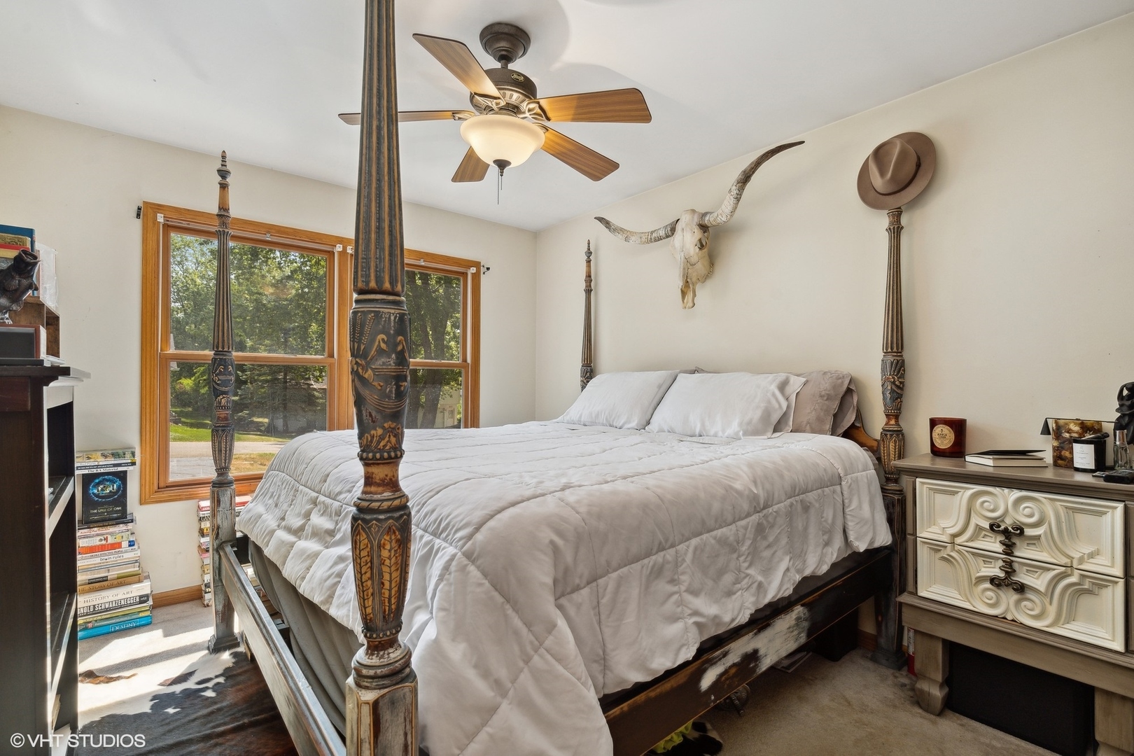 4407 Maple Leaf Drive Johnsburg, IL 60051 - Photo 12 of 17 a bedroom with a bed and a chandelier