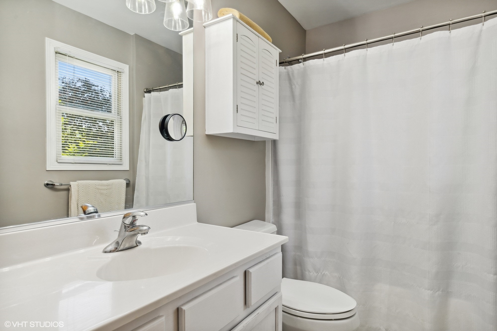 4407 Maple Leaf Drive Johnsburg, IL 60051 - Photo 13 of 17 a bathroom with a sink a toilet and shower