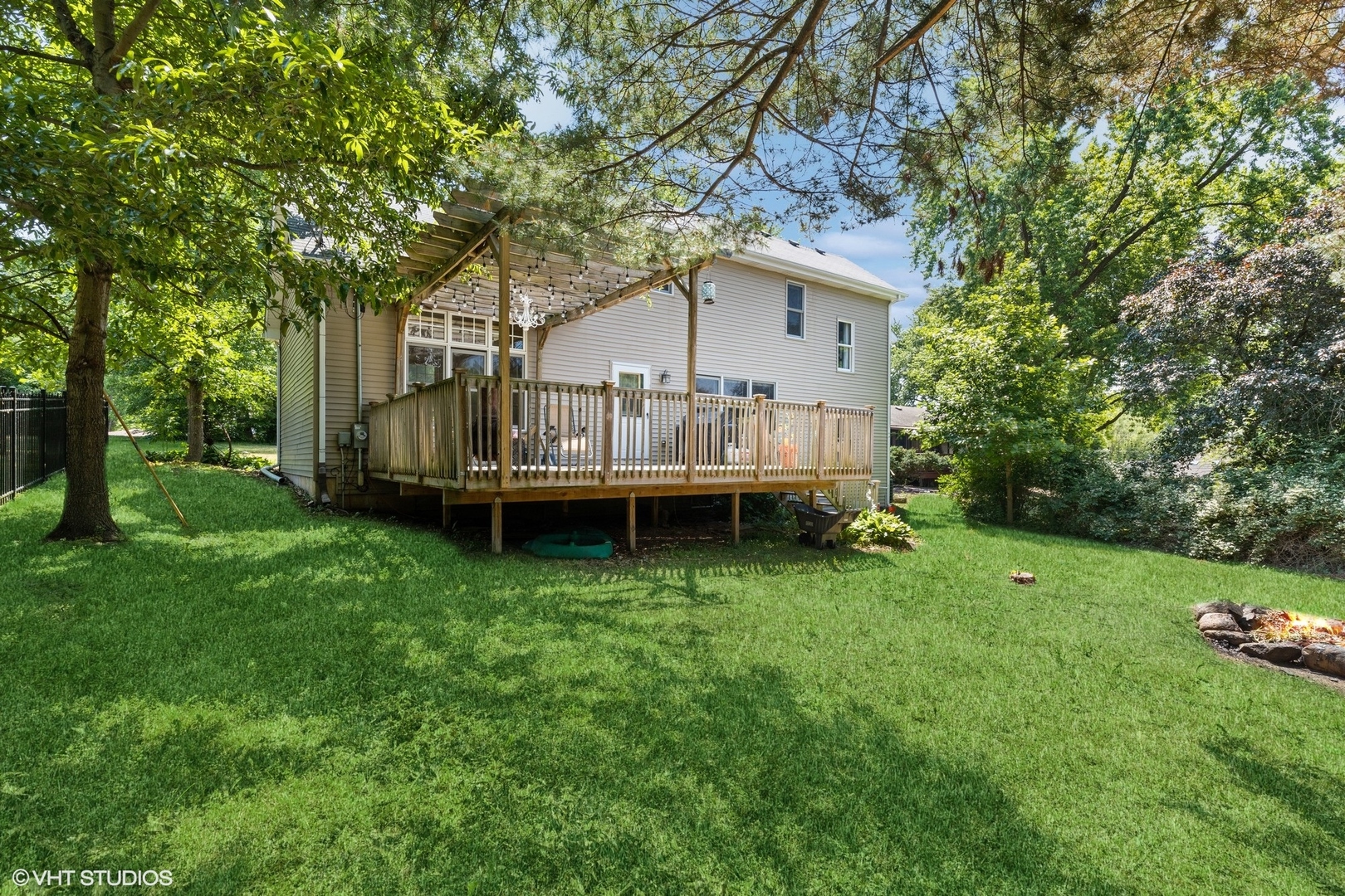 4407 Maple Leaf Drive Johnsburg, IL 60051 - Photo 16 of 17 a view of backyard with large trees and a small yard