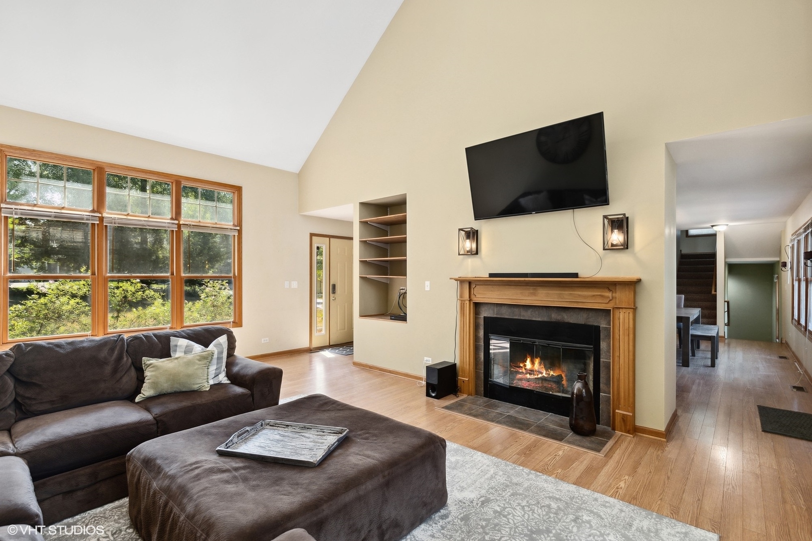 4407 Maple Leaf Drive Johnsburg, IL 60051 - Photo 3 of 17 a living room with furniture a flat screen tv and a fireplace