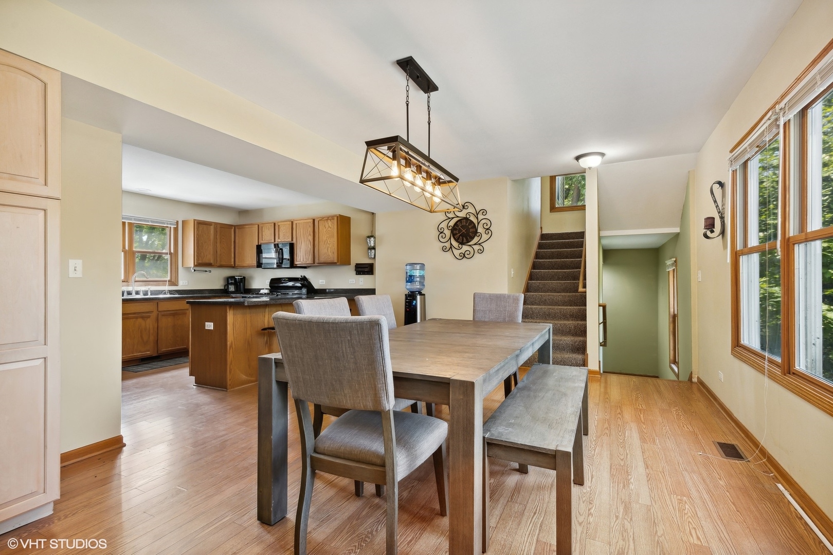 4407 Maple Leaf Drive Johnsburg, IL 60051 - Photo 6 of 17 a view of a dining room with furniture and wooden floor