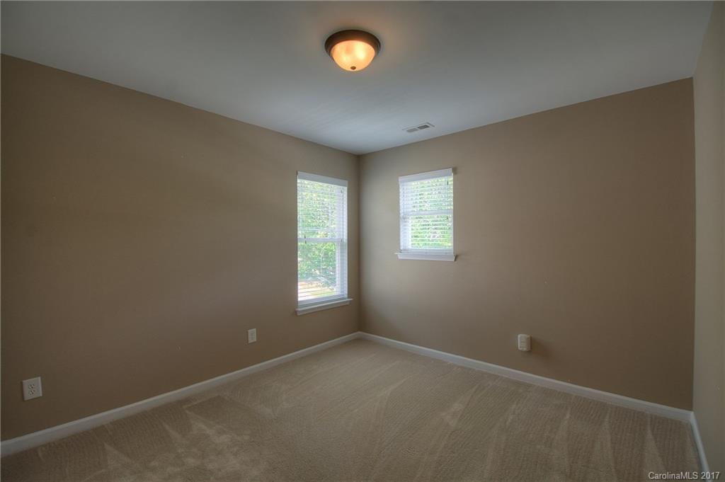 8813 Washam Potts Road Cornelius, NC 28031 - Photo 11 of 24 an empty room with a window