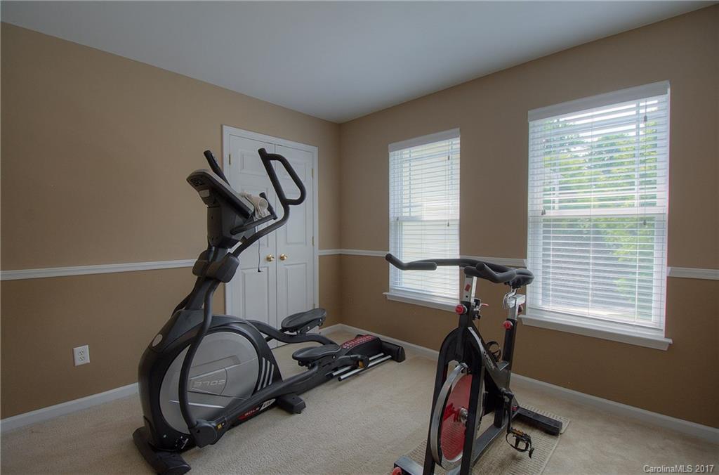 8813 Washam Potts Road Cornelius, NC 28031 - Photo 13 of 24 a view of a room with gym equipment