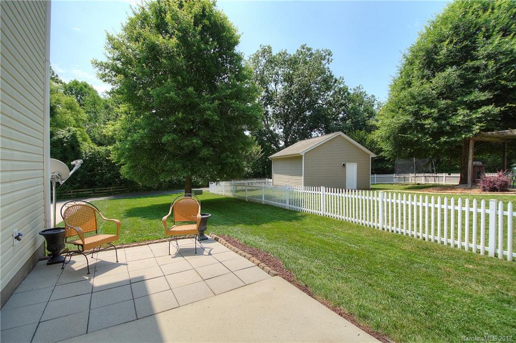 8813 Washam Potts Road Cornelius, NC 28031 - Photo 17 of 24 a house view with a garden space
