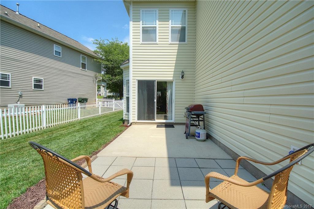 8813 Washam Potts Road Cornelius, NC 28031 - Photo 18 of 24 a view of a terrace with chairs and a table