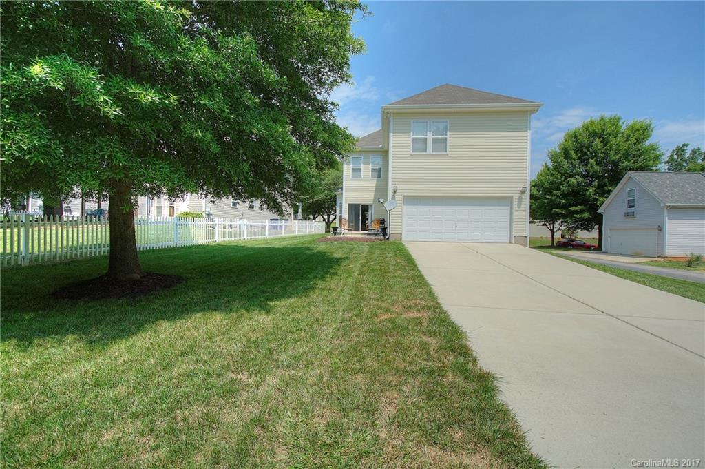 8813 Washam Potts Road Cornelius, NC 28031 - Photo 19 of 24 a front view of a house with yard