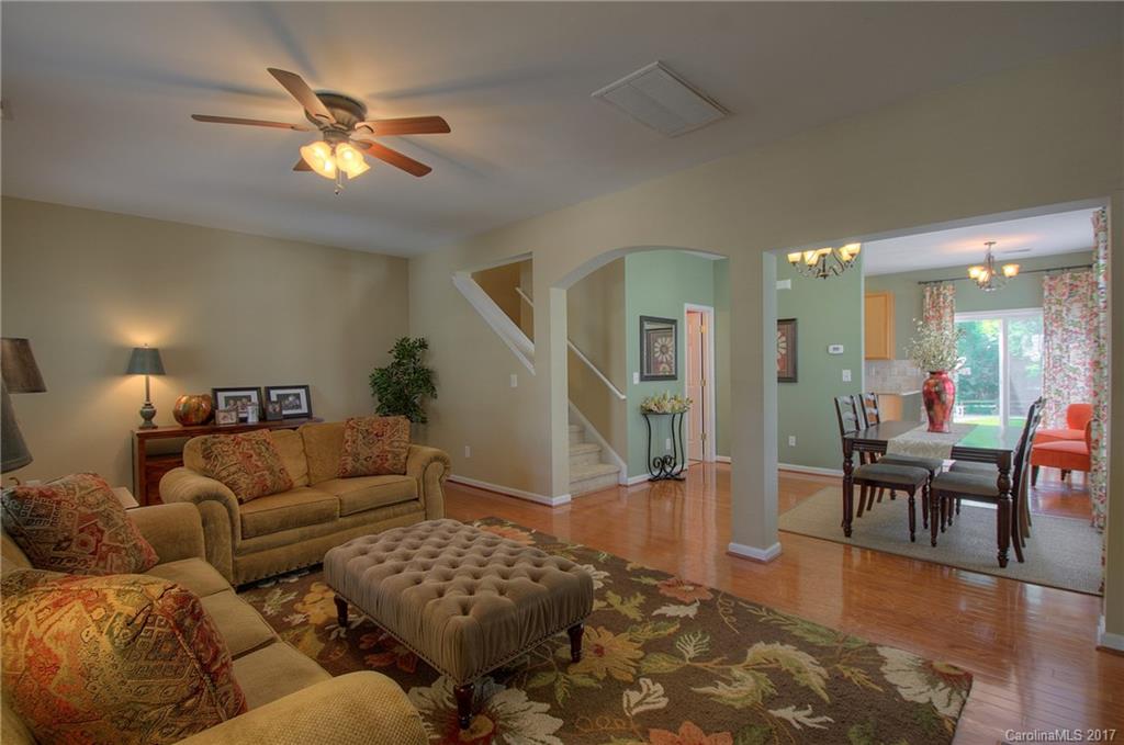 8813 Washam Potts Road Cornelius, NC 28031 - Photo 4 of 24 a living room with furniture and wooden floor