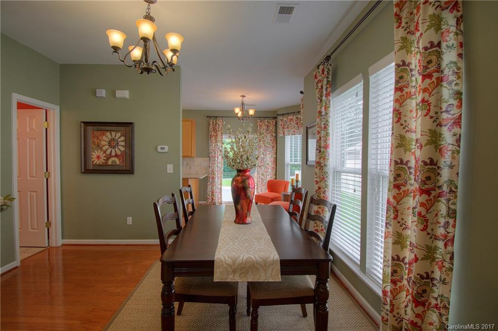 8813 Washam Potts Road Cornelius, NC 28031 - Photo 5 of 24 a view of a dining room with furniture and chandelier