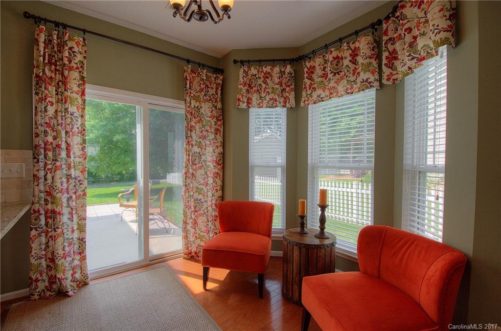 8813 Washam Potts Road Cornelius, NC 28031 - Photo 6 of 24 a living room with furniture and a large window