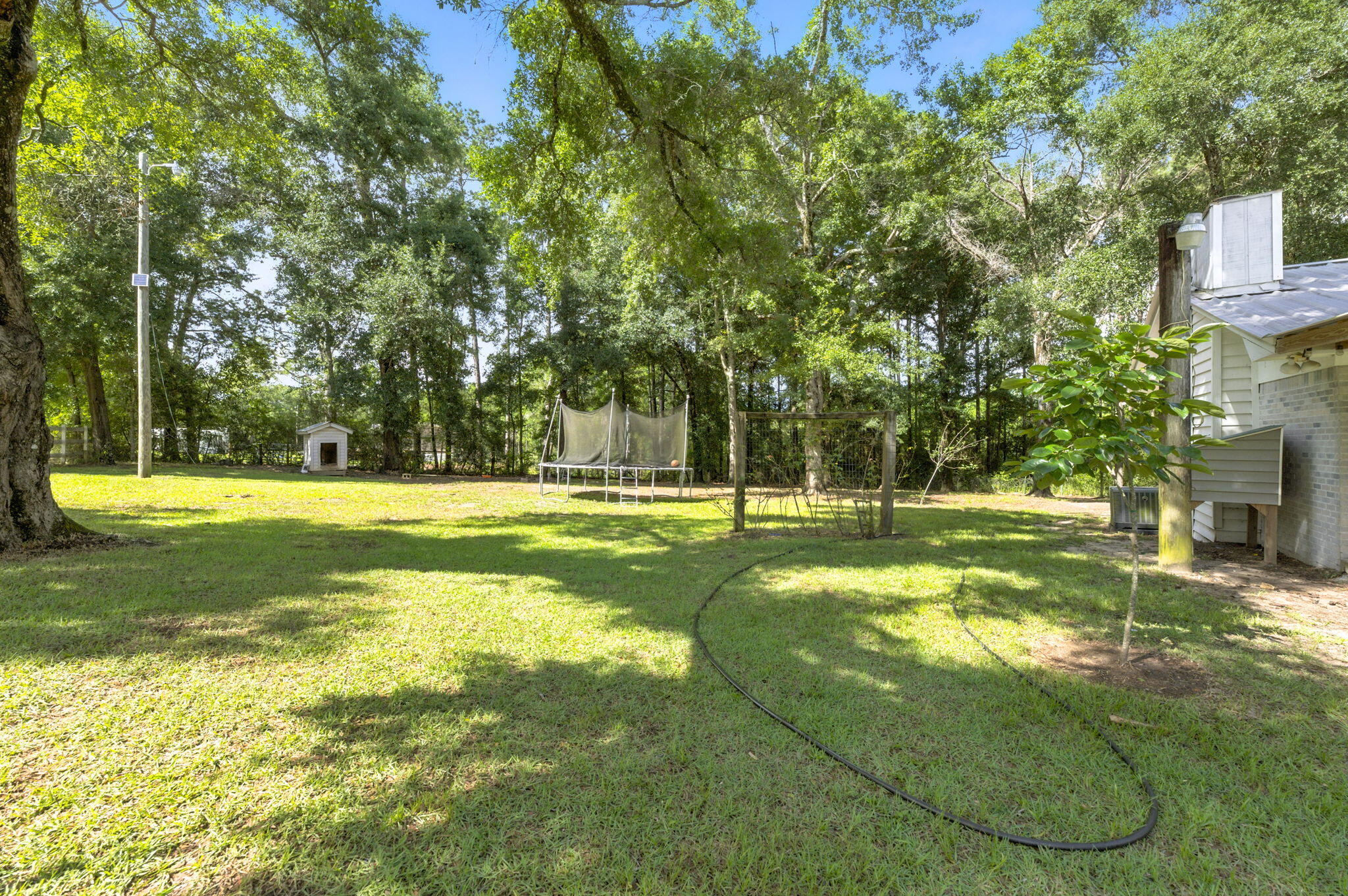 3774 Laird Road Crestview, FL 32539 - Photo 35 of 43 a view of swimming pool with a big yard and large trees