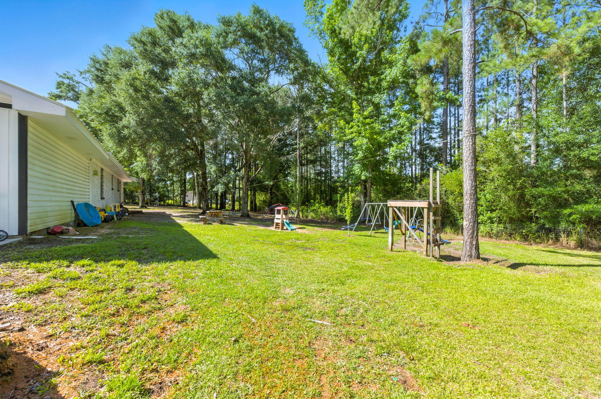 3774 Laird Road Crestview, FL 32539 - Photo 39 of 43 a view of a backyard with swimming pool