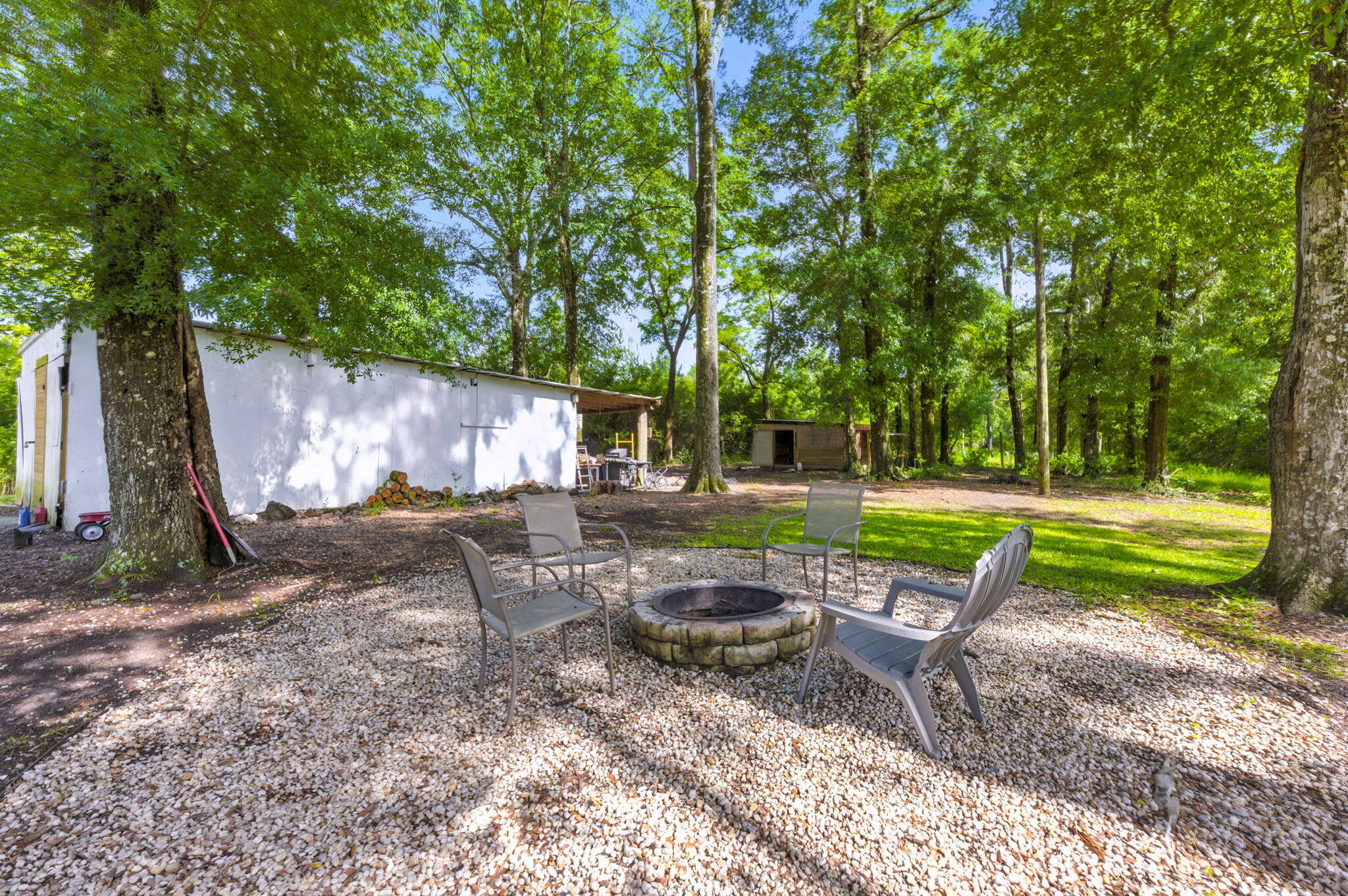 3774 Laird Road Crestview, FL 32539 - Photo 40 of 43 a view of backyard with swimming pool and table and chairs