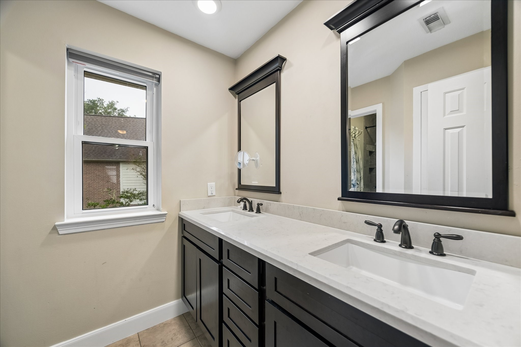 23039 Enchanted Landing Lane Katy, TX 77494 - Photo 28 of 30 a bathroom with 2 sink and a mirror