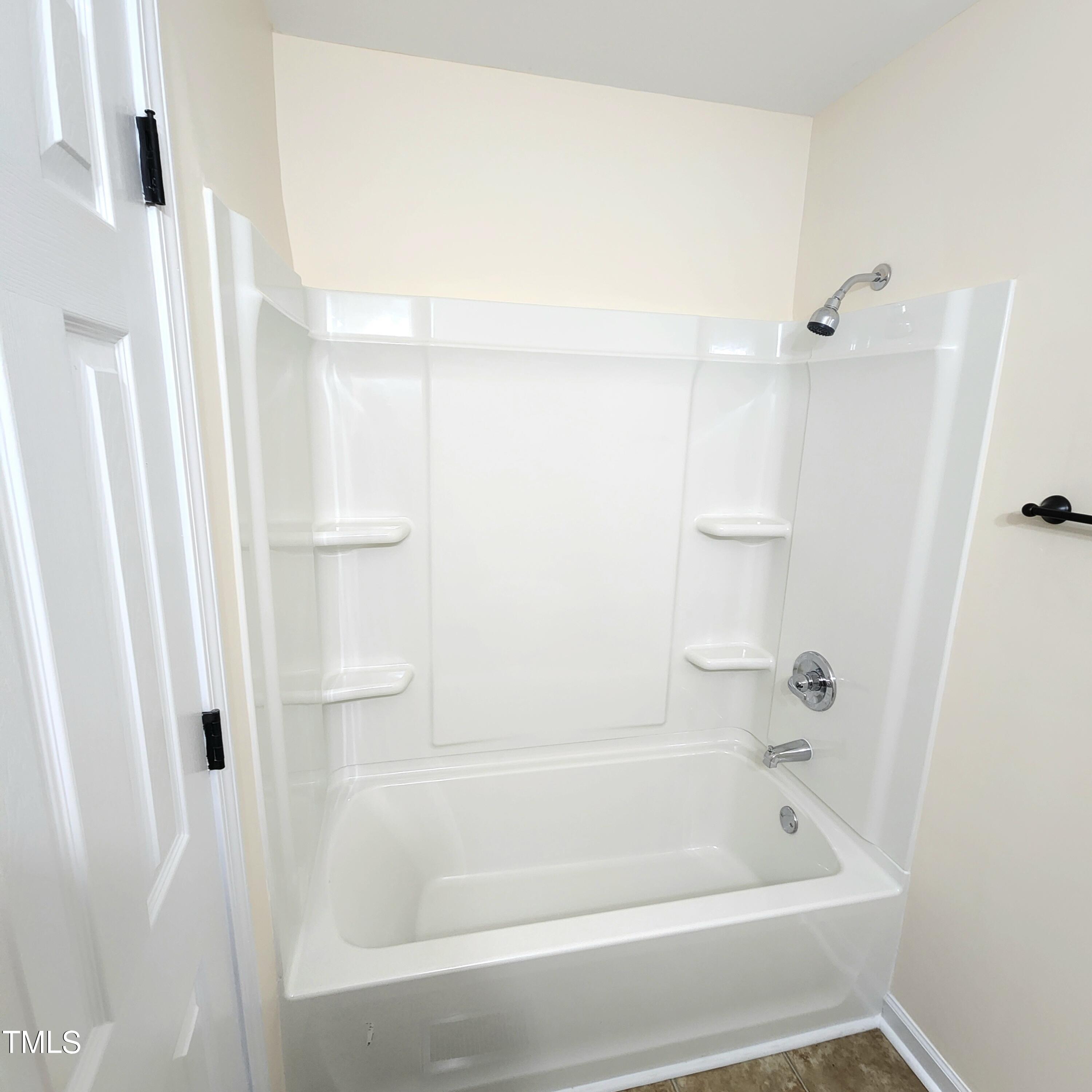 110 Sycamore Street Dunn, NC 28334 - Photo 16 of 28 a bathroom with a bathtub