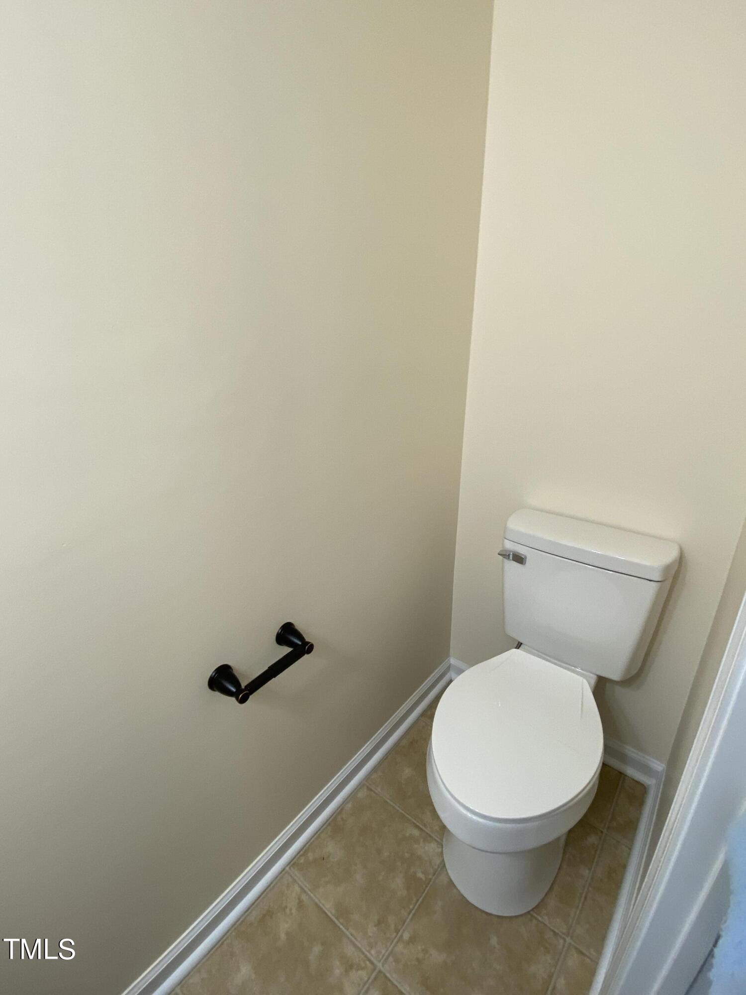 110 Sycamore Street Dunn, NC 28334 - Photo 22 of 28 a white toilet sitting next to a white wall