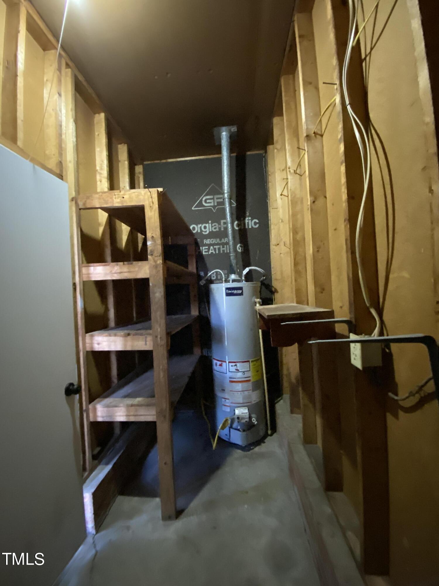 110 Sycamore Street Dunn, NC 28334 - Photo 23 of 28 a view of walk in closet with clothes and shoes