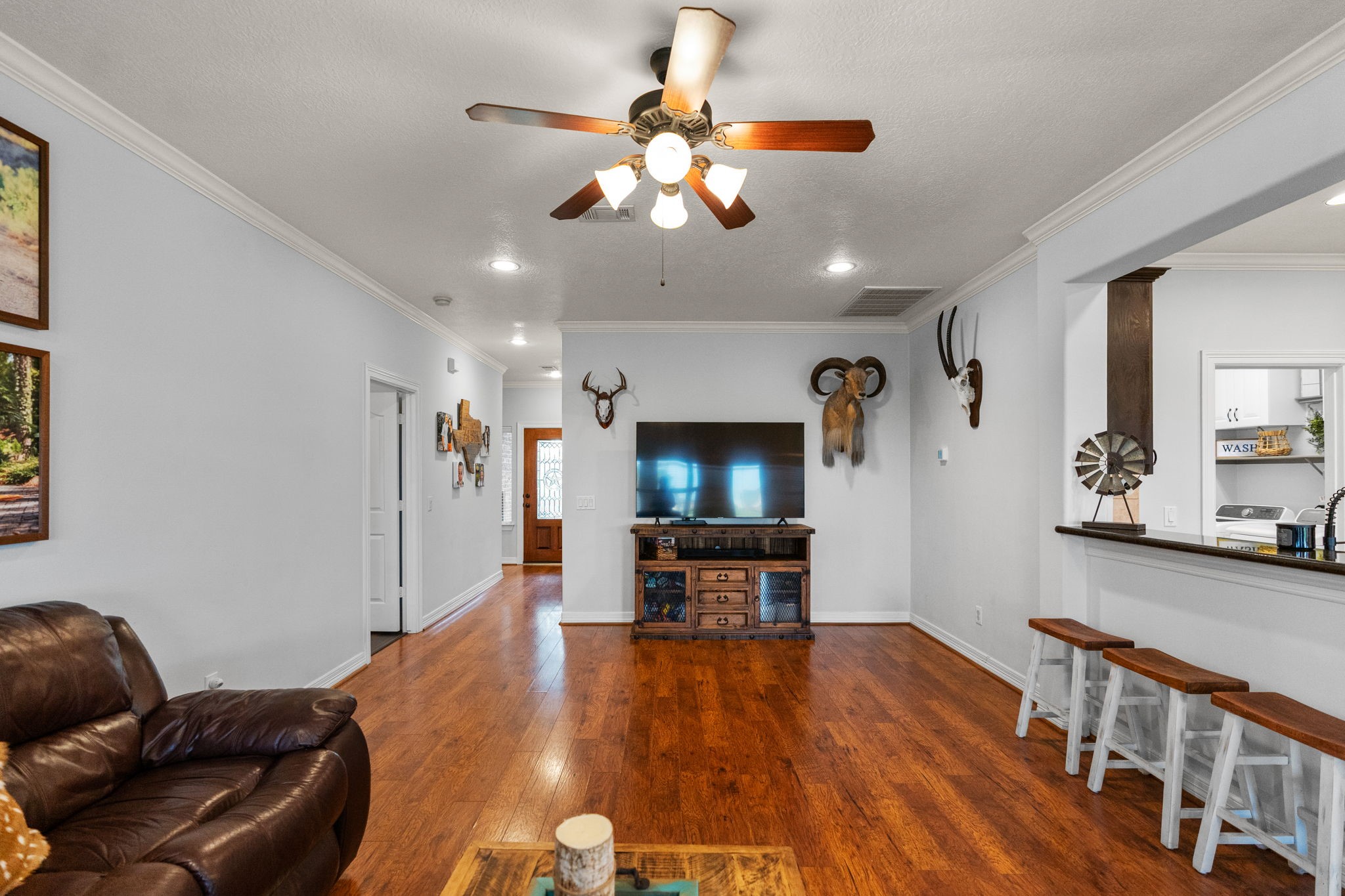 5942 Wildflower Road Sealy, TX 77474 - Photo 6 of 41 a living room with furniture and a flat screen tv