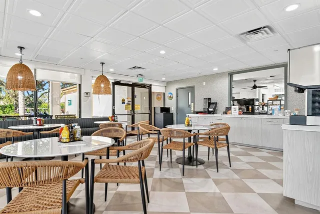 an aerial view of residential houses with outdoor space and swimming pool
