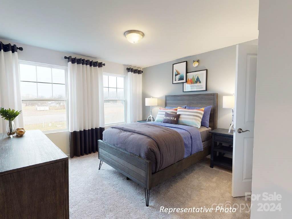 1207 Dan River Southwest, Unit 159 Concord, NC 28027 - Photo 12 of 13 a bedroom with a bed and a window