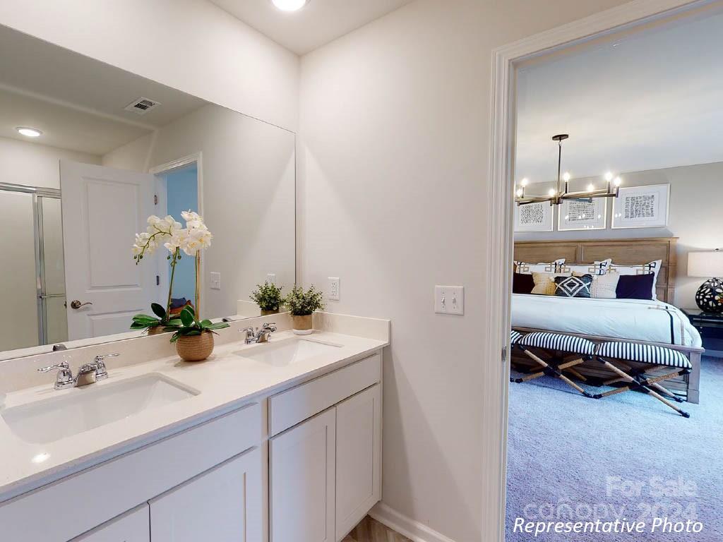 1207 Dan River Southwest, Unit 159 Concord, NC 28027 - Photo 10 of 13 a en suite bathroom with a sink and a mirror