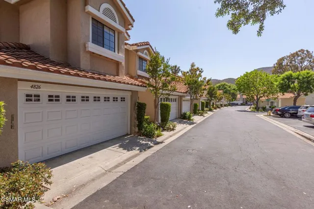 a view of a street with a building in the background
