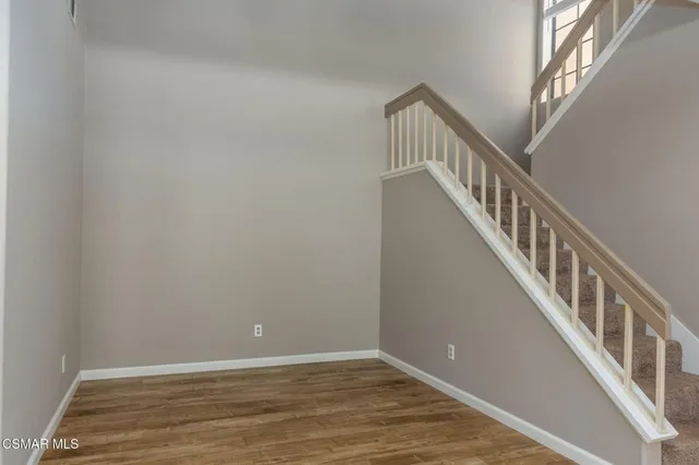 a view of an entryway with wooden floor