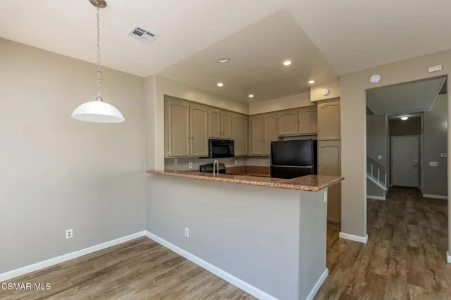a view of a kitchen with a sink