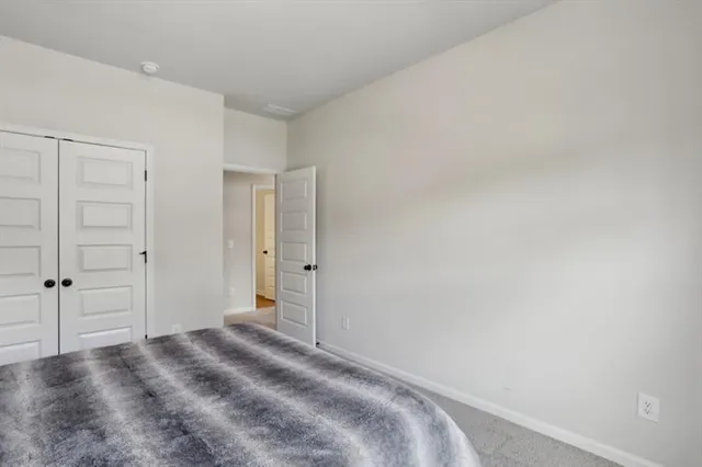 a utility room with dryer washer and empty racks