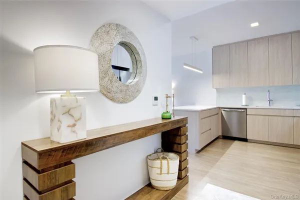 a kitchen with a sink cabinets and window