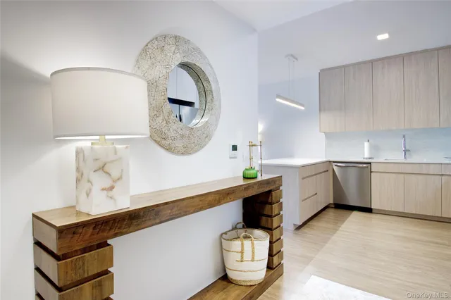 a kitchen with a sink cabinets and window