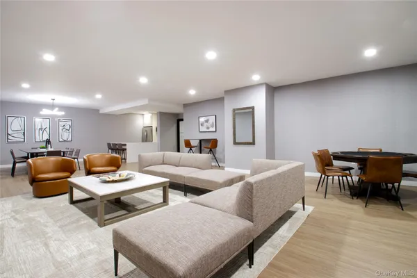 a living room with furniture and a piano
