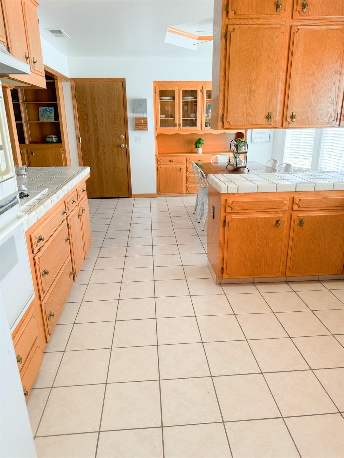 2544 Sterling Avenue Sanger, CA 93657 - Photo 13 of 27 a kitchen with stainless steel appliances a sink a counter top space and a window