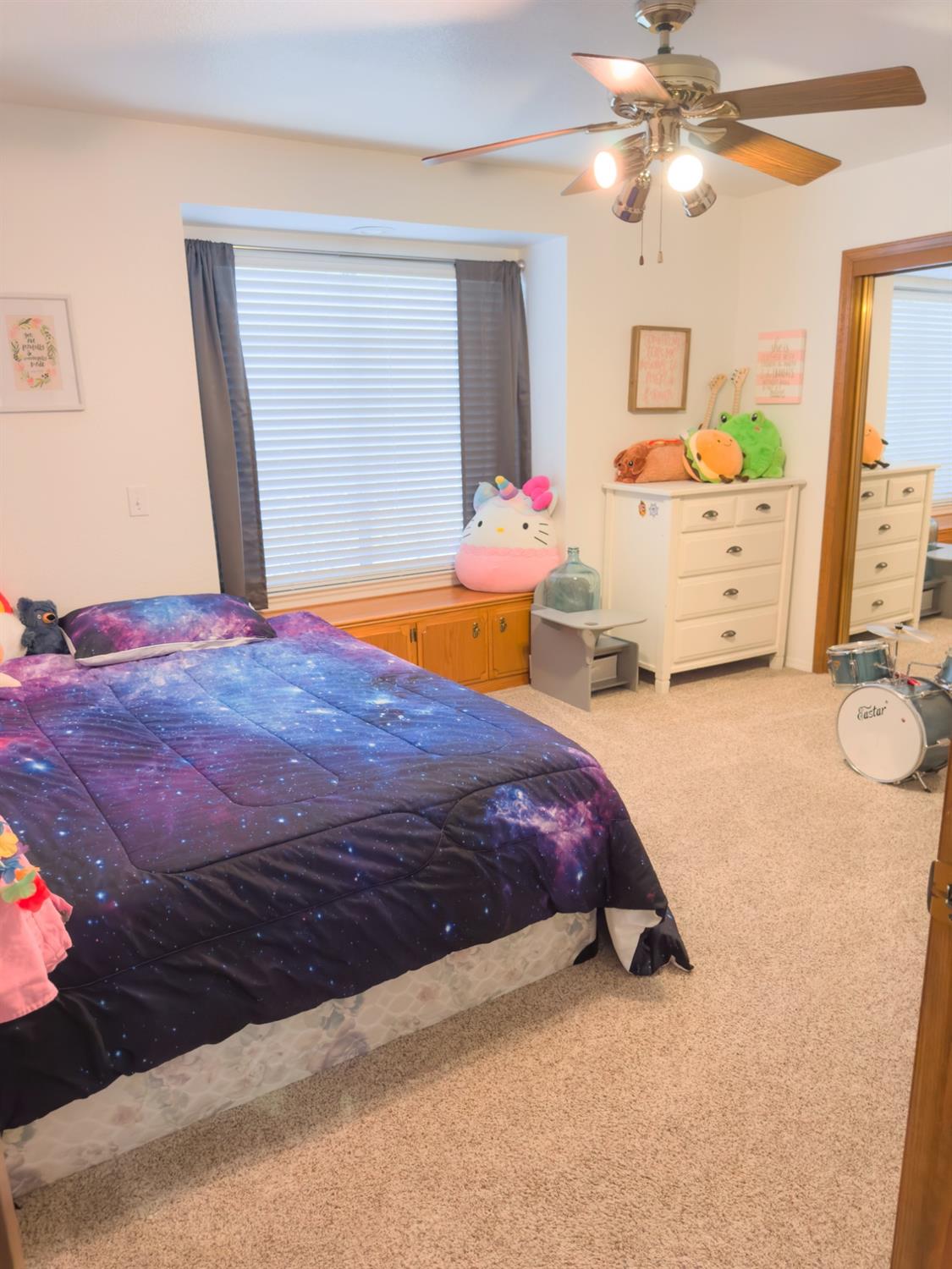 2544 Sterling Avenue Sanger, CA 93657 - Photo 16 of 27 a bedroom with a bed dresser and a window