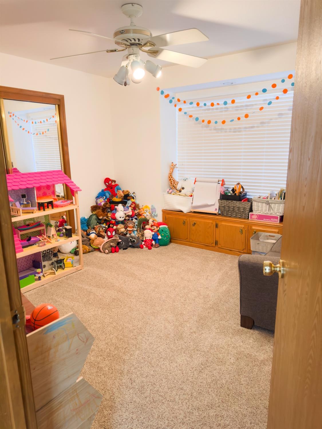 2544 Sterling Avenue Sanger, CA 93657 - Photo 18 of 27 a room with toys and a chandelier