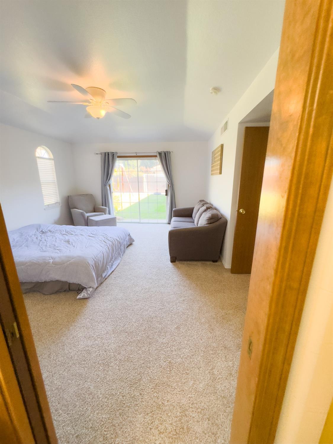 2544 Sterling Avenue Sanger, CA 93657 - Photo 20 of 27 a bedroom with a bed and a couch