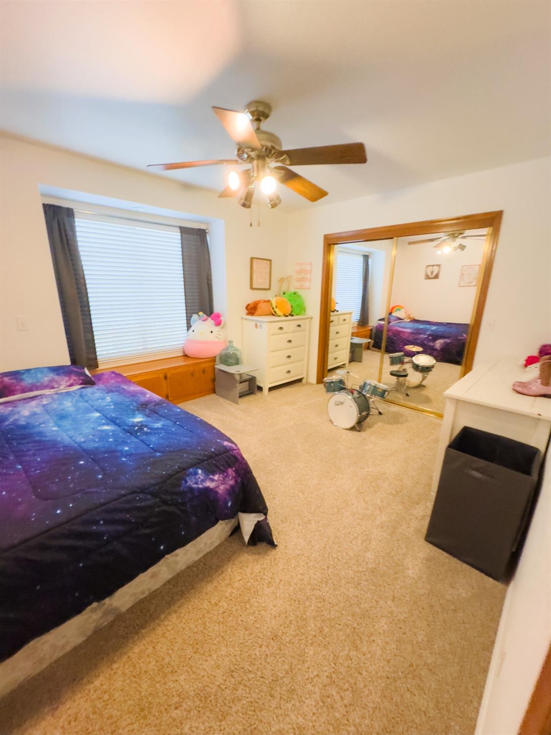 2544 Sterling Avenue Sanger, CA 93657 - Photo 21 of 27 a bedroom with a bed dresser and window