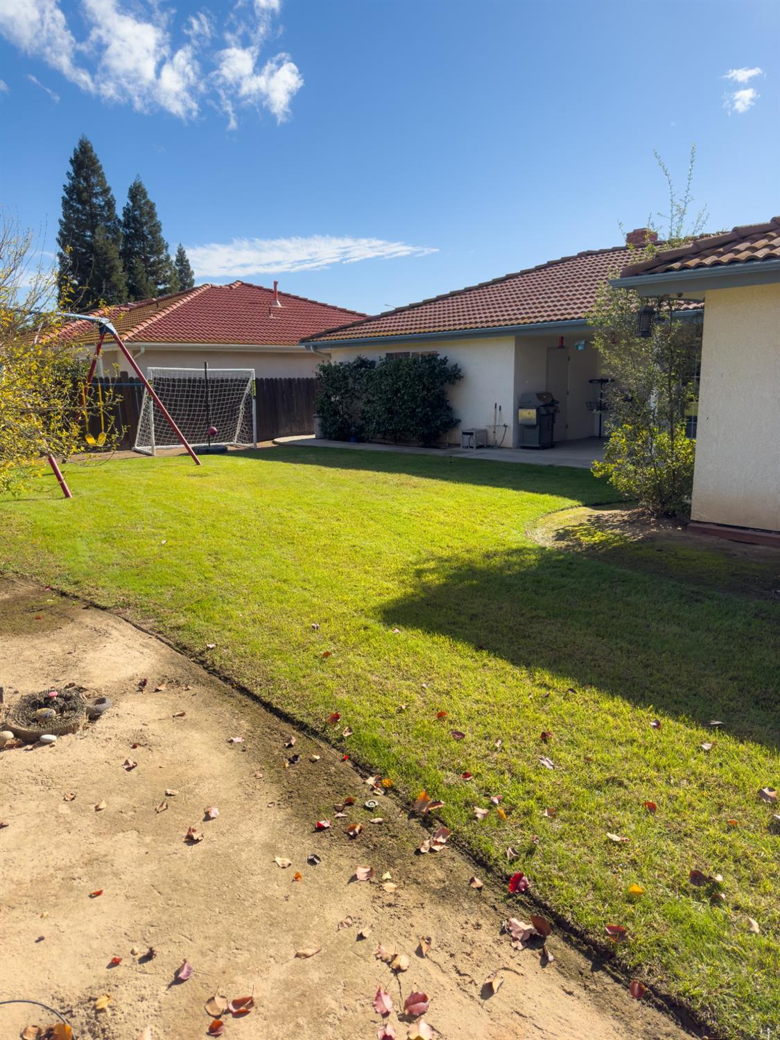 2544 Sterling Avenue Sanger, CA 93657 - Photo 26 of 27 a view of a house with a yard