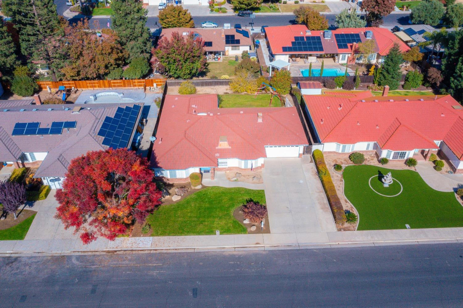2544 Sterling Avenue Sanger, CA 93657 - Photo 5 of 27 an aerial view of a tennis ground and a cars park