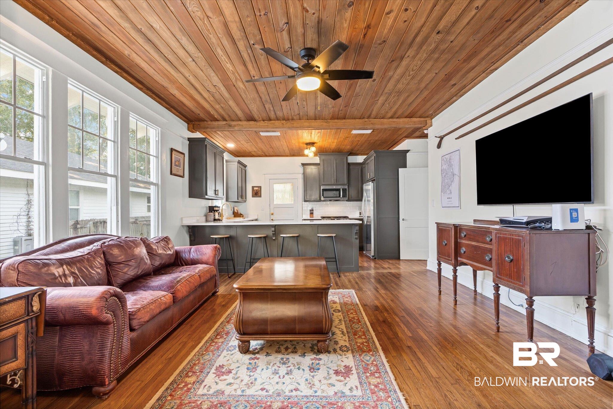 11 South Lafayette Street Mobile, AL 36604 - Photo 2 of 20 Living area with ceiling fan, wooden ceiling, and dark wood-style floors