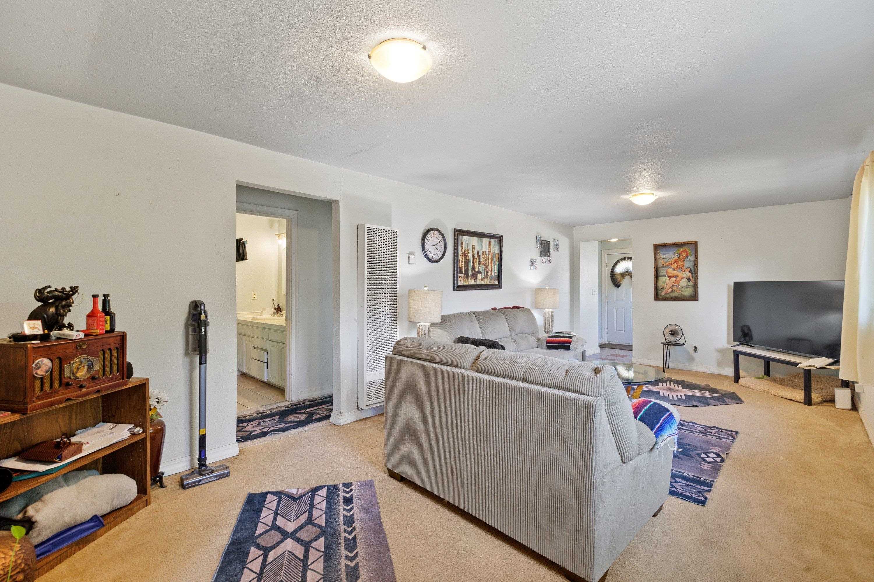 1220 5th Avenue Corning, CA 96021 - Photo 4 of 15 a living room with furniture and a flat screen tv