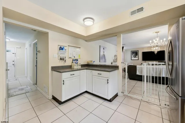 a kitchen with a sink and a stove top oven