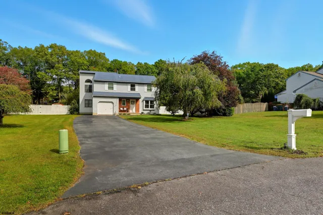 a view of a house with a big yard