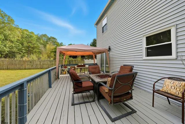 a view of a two chairs and table in the balcony