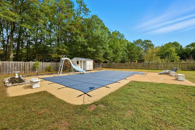 a view of a swimming pool with a patio
