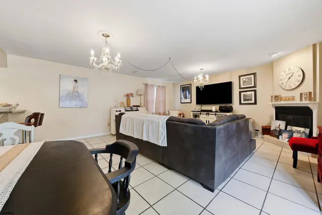a living room with furniture fireplace and a flat screen tv