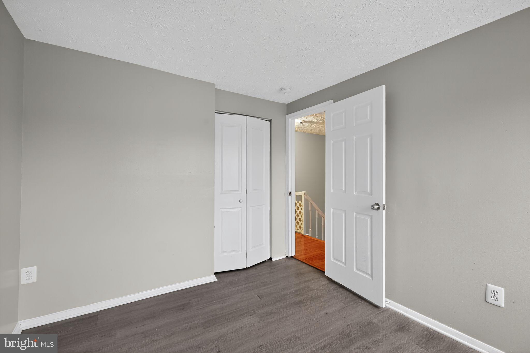 3602 Castle Terrace, Unit 116102 Silver Spring, MD 20904 - Photo 13 of 30 a view of an empty room and wooden floor